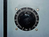 Close-up of front panel power/output control dial graduated 0–100