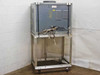 Rear view of Lepel RF Generator cabinet on rolling cart showing louvered exhaust vents and water cooling hose connections
