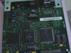 HP J2553-60001 JetDirect card PCB rear view showing Delta transformer, main controller ICs, and barcode label