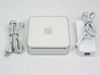 Apple Mac Mini A1176 desktop computer shown from above with Apple AC adapter and power cord