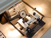 Microm HM500 OM interior close-up – microtome cutting head with blade holder, specimen clamp assembly, and anti-roll plate