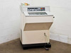 Microm HM500 OM cryostat microtome – front-left three-quarter view with foot pedal and small accessory box on top