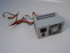 Acer AP4300 Delta DPS-145PB-82 145W ATX power supply – three-quarter front view showing output cables, IEC inlet, power switch, and cooling fan