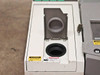 Nicolet Magna-IR 560 left source/sample compartment open showing cylindrical aperture ports and laser and burn hazard caution stickers