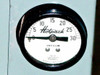 Hotpack vacuum gauge close-up — Marsh Instrument Company 0 to 30 in Hg dial mounted on oven side panel
