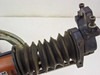 Close-up of AVC-2 accordion rubber bellows and carriage end bracket with adjustment screws — shows bellows condition and carriage detail