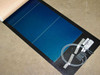 Uni-Solar PVL-116 flexible panel laid flat showing full-width blue amorphous cells, black backing, and MC3 junction box with cable on right side