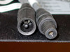 Close-up of MC3 connector pair — male and female push/pull connectors on Uni-Solar PVL-116 solar panel cable