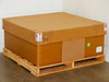 Uni-Solar PVL-128 carton of 30 sealed on wooden pallet — exterior view showing fragile and do-not-stack labels, green inventory sticker
