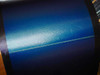 Close-up of Uni-Solar PVL-136 flexible amorphous thin-film solar cell surface showing blue iridescent photovoltaic material