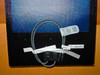 Uni-Solar PVL-136 flexible solar panel rear showing output lead cable with quick-connect connector, serial number label, and barcode tag