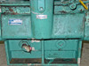 Kinney KDH-130 pump body lower section – SUCTION label, rating plate, significant paint chipping and rust at plug fitting, square recessed port visible