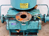 Kinney KDH-130 front face close-up – large flanged suction port open showing interior bore, heavy surface rust on flange face, SUCTION label, discharge port at right, yellow dipstick
