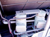 Trane CGAF-C20 interior — two Trane 3-D Scroll compressors with refrigerant suction and discharge lines and insulated piping