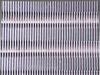 Trane CGAF-C20 condenser coil close-up — aluminum fin array in good condition with minor discoloration, no significant fin damage visible
