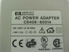HP Hewlett-Packard C6409-60014 AC power adapter label showing 100-240V input and 18V 1.1A DC output