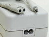 HP C4557-60004 AC Adapter — close-up of IEC C7 figure-8 AC input port and DC barrel output connector tip