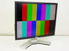 Dell 1907FPt 19-inch LCD monitor front view displaying color bar test pattern on silver and black stand