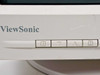ViewSonic E655 front bezel close-up showing ViewSonic logo and four OSD control buttons with surface scuffing visible on bezel panel