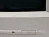 ViewSonic E655 lower front bezel showing power button area with paint chipping and cracking above the button and yellowing on the power button strip