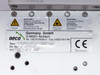 AECO CDIS-C DVD5 Mini 1.5 label close-up showing model type CDIS-C DVD5 Mini 1.5, serial number, voltage rating 230 VAC 0.6A, CE mark, and AECO Germany GmbH D-86551 Aichbach contact info with electrical and laser safety warnings