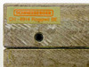 Close-up of Schneeberger label reading CH-4914 Roggwil BE in orange text on gold-green background, with central lubrication port below label
