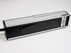 Spectroline ENF-280C UV lamp unit – side/bottom view showing UV filter window and lamp body with caution label