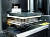 Titertek Zoom 96-pin stainless steel aspirate/dispense wash head manifold close-up with plate carrier and adjustment knobs