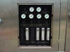 FSI 2134N front pressure and flow panel showing 8 analog pressure gauges labeled etch gas, solvent, and process air pressures, with 4 inline flow meters