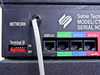 Sable Technologies CT90 MK1.1 rear panel closeup showing NETWORK port, Terminal ID DIP switch, DISPLAY port, and Device 0/1/2 ports with network cable attached