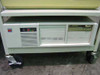 IBM desktop PC on lower shelf of wheeled cart with floppy drives and power indicator LEDs visible
