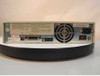 HP 9122C disk drive rear panel — shows power connector, fan, DB-25 interface port, HP label, and model/serial sticker