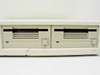 HP 9121D front panel close-up showing both 3.5-inch dual floppy drive bays with eject buttons and indicator lights, and visible crack along lower faceplate