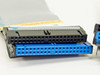 Close-up of included ribbon cable connectors showing gray standard IDE 40-pin and blue ATA/100 style connector ends