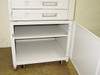 HP 2500-sheet rolling paper cabinet with door open, showing interior shelf and caster wheels