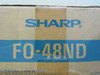 Sharp FO-48ND box label closeup showing Sharp logo and model number FO-48ND with Toner Developer Kit text