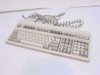 HP C1405A 102-key AT mechanical keyboard top view with coiled cord and 5-pin DIN connector