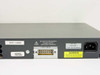Cisco WS-C2960-24TT-L rear panel close-up showing IOS version 12.2(25)SEE2 label, RPS +12V/6.5A connector, and power rating 100-240V 1.3A-8A 50-60Hz