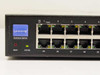 Linksys SLM2048 front panel left section — Business Series badge, RESET button, SYSTEM LED, and RJ-45 ports 1–5 and 25–29 with LNK/ACT indicators