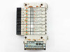 SMC VQ1200-5 solenoid valve manifold front face – eight valve stations with red and green indicator LEDs, solenoid coil connectors, and serial unit at bottom