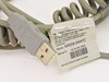 Close-up of MX009-2MA7C USB converter cable label showing model, serial number, and June 2004 manufacture date