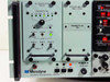 Microdyne 1400-MR front panel close-up showing PM Demodulator 1451-D, IF Filter Amplifier 1420 I Series, 100 KHz bandwidth selector, loop width controls, and REC/PBK/CAL mode switches