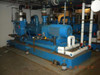 SIHI LPH 85353 vacuum pump skid — rear/opposite side view showing pump body, motor, anti-vibration mounts, water supply piping with red-handled valve, and facility ceiling piping