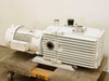 Leybold-Heraeus D60AC Trivac vacuum pump – right-side view showing motor end, large circular side port on pump body, and paint chipping on motor housing