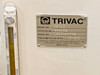 Leybold-Heraeus D60AC Trivac vacuum pump nameplate showing model D60AC, catalog number 698189, HE-200 oil specification, and Made in USA