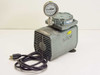 Gast DOA-V191-AA oilless diaphragm vacuum pump — front-left 3/4 view showing gray cast body with louvers, Pacific Scientific gauge on top, power cord, and rubber feet