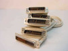 Proprietary DB25 male 1-to-4 fan-out aggregator cable showing all five connectors fanned out