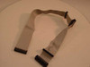 Dual floppy drive ribbon cable full length view showing three connectors on white surface