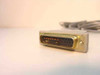DB25 male connector end of gray serial cable — close-up showing 25-pin plug