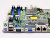 Supermicro PDSMA server motherboard — close-up of rear I/O panel showing PS/2 ports, USB, DB9 serial, VGA, and dual Gigabit Ethernet RJ-45 ports